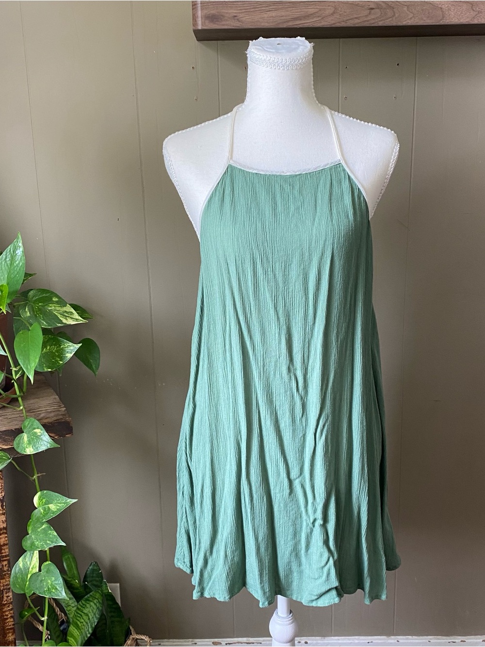 green O'Neill Siesta halter neck dress featuring adjustable strappy ties